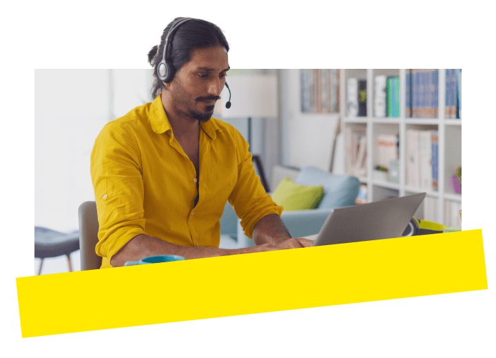 Professional using GoTo Connect’s unified phone system on their computer while working from home.